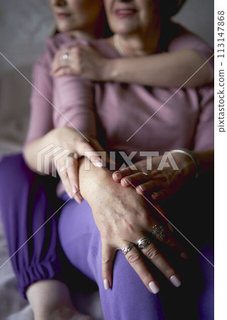 portrait of old mother and middle-aged daughter at home 113147868