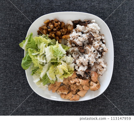 Homemade grilled chicken with grilled chopped eggplant, green salad, and rice Pilaf with mushrooms Homemade grilled chicken with grilled chopped eggplant, green salad, and rice Pilaf with mushrooms 113147959