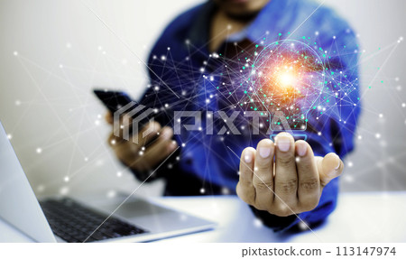 Business People touch Light bulb.Concept of Ideas for Success. Concept with Innovation Invention. Success Starting from a new idea to innovative technology based on data from the Internet, big data.. 113147974