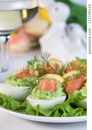 Stuffed eggs with avocado and salmon Stuffed eggs with avocado and salmon 113148128