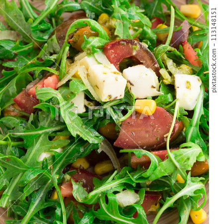 Mixed salad of arugula and fresh vegetables with sauce Mixed salad of arugula and fresh vegetables with sauce 113148151