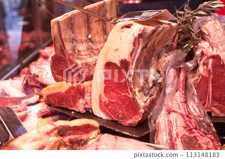 Pork, beef, tenderloin, meatballs, entrecote, ham, carbonate in refrigerator on market counter 113148183
