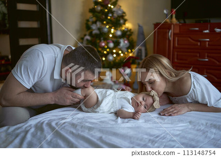 adorable parents with their little baby adorable parents with their little baby 113148754