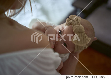 Caucasian mother brestfeed her child 113148808