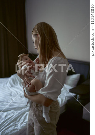 mother take care of her child, holds close mother take care of her child, holds close 113148810