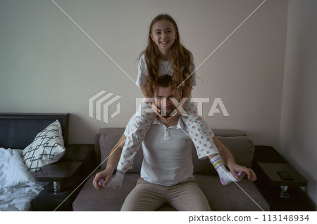 father plays with his daughter 113148934