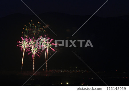 Fireworks color the night sky in early summer 113148939