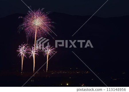 Fireworks color the night sky in early summer 113148956