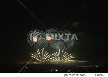 Fireworks color the night sky in early summer 113148963