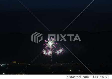 Fireworks color the night sky in early summer 113148972