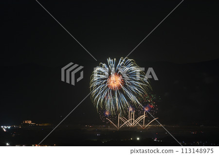 Fireworks color the night sky in early summer 113148975