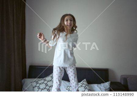girl jump on a bed girl jump on a bed 113148990
