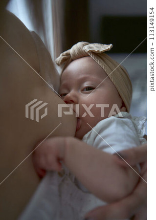 Caucasian mother brestfeed her child 113149154
