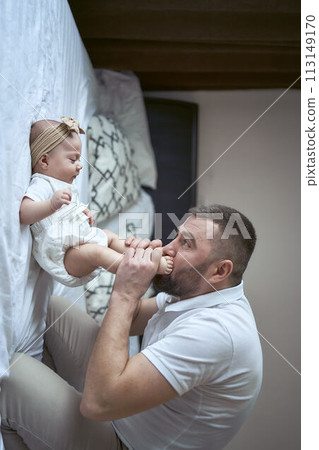 father plays with his daughter 113149170