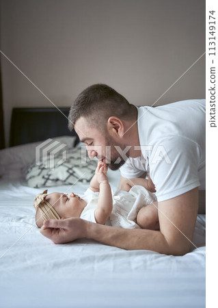 father plays with his daughter 113149174