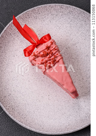 Delicious sweet cheesecake with fruits covered with icing with a wooden stick Delicious sweet cheesecake with fruits covered with icing with a wooden stick 113150868