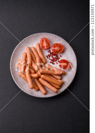 Delicious fresh small vegetarian sausages with salt, spices and herbs 113150971