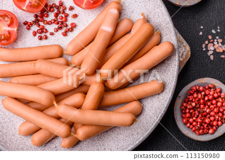 Delicious fresh small vegetarian sausages with salt, spices and herbs 113150980