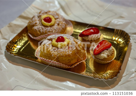 Zeppole di San Giuseppe, typical Italian homemade dessert for Father's Day Zeppole di San Giuseppe, typical Italian homemade dessert for Father's Day 113151036