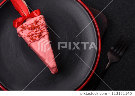 Delicious sweet cheesecake with fruits covered with icing with a wooden stick 113151140