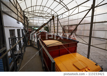 Probe tester plunges into the truck trailer to collect wheat for quality analysis. Automatic control system, testing machine at mill, bakery, bread factory or grain elevator terminal. 113153421