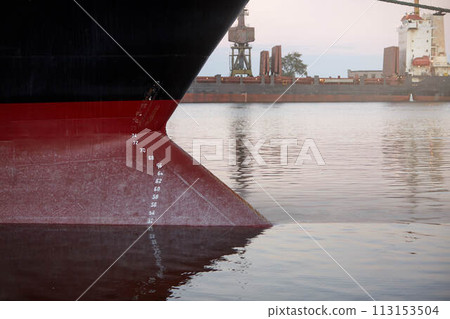 Draft marks on a ship - waterline numbers on bow and stern of a vessel at seaport 113153504