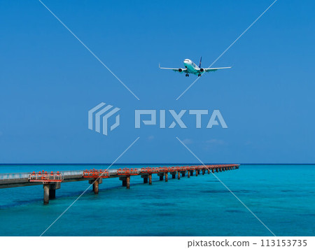 Aircraft landing at emerald green Shimojishima Airport 17END 113153735