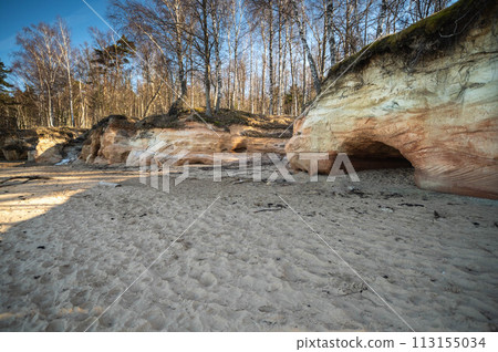 Sunlight Casting Shadows on Eroded Forest Rocks. Veczemju cliffs, Latvia Sunlight Casting Shadows on Eroded Forest Rocks. Veczemju cliffs, Latvia 113155034