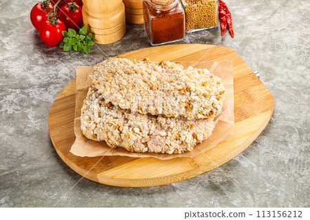 Breaded raw breaded meat schnitzel 113156212