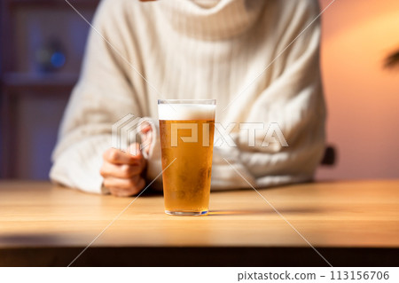 Woman drinking beer Woman drinking beer 113156706