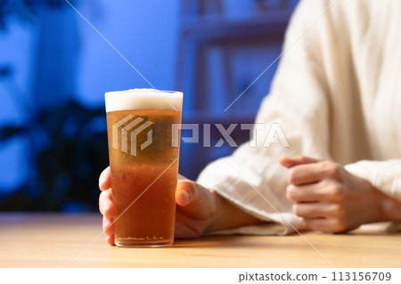 Woman drinking beer Woman drinking beer 113156709