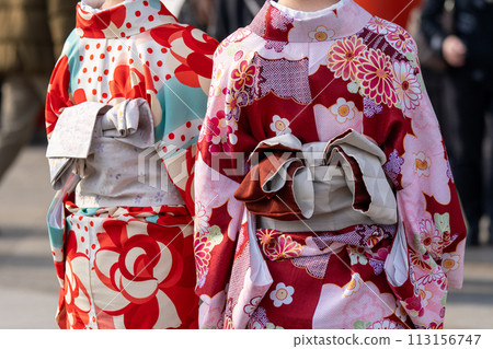 Young girl wearing Japanese kimono standing in front of Sensoji Temple in Tokyo, Japan. Kimono is a Japanese traditional garment. The word "kimono", which actually means a "thing to wear" 113156747