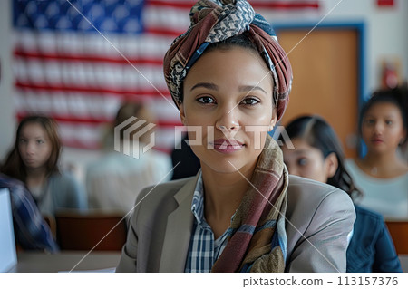 portrait Young mixed-race woman at polling station with US flag on wall behind portrait Young mixed-race woman at polling station with US flag on wall behind 113157376