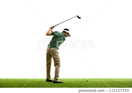 Rear view portrait of young athletic man, professional golfer playing golf on green lash grass against white studio background. 113157793