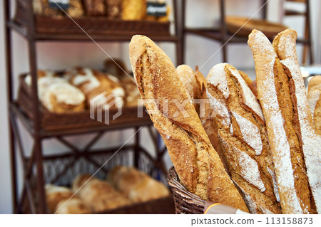 Bread baguettes in basket at baking shop Bread baguettes in basket at baking shop 113158873