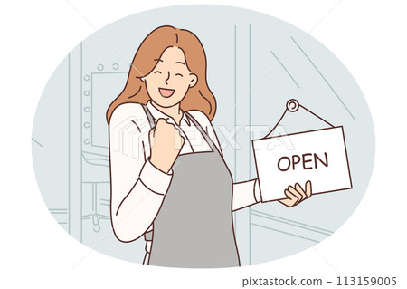 Woman owner of beauty salon makes victory gesture standing near front door with sign open Woman owner of beauty salon makes victory gesture standing near front door with sign open 113159005