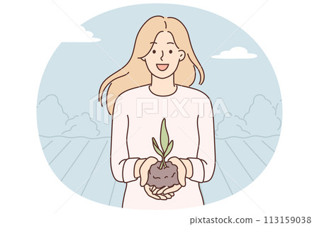 Woman demonstrates handful of soil with young plant for concept of caring for nature 113159038