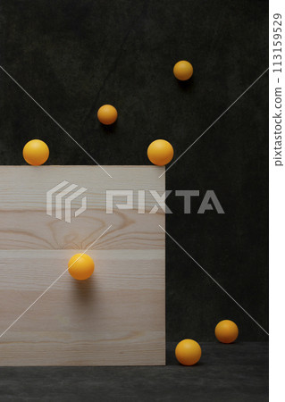 Abstract still life with balls on a wooden board Abstract still life with balls on a wooden board 113159529