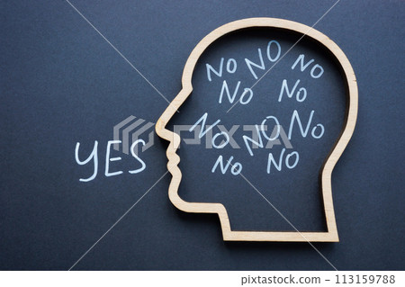 Learn to say no concept. Outline of a head with the word yes. Learn to say no concept. Outline of a head with the word yes. 113159788