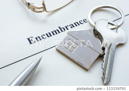 Pen, house key and document about encumbrance. Pen, house key and document about encumbrance. 113159791