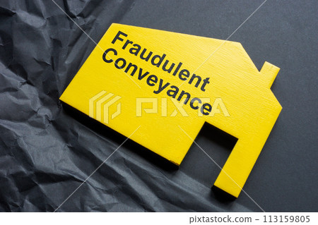 Crumpled paper and a figurine of a house with an inscription Fraudulent conveyance. Crumpled paper and a figurine of a house with an inscription Fraudulent conveyance. 113159805
