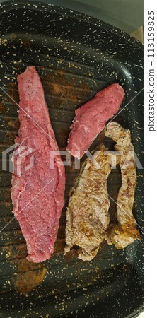 Various stages of steak cooking 113159825