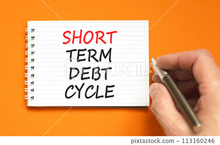 Short term debt cycle symbol. Concept words Short term debt cycle on beautiful white note. Beautiful orange background. Businessman hand. Business Short term debt cycle concept. Copy space 113160246