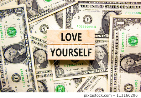 Love yourself symbol. Concept words Love yourself on beautiful wooden blocks. Dollar bills. Beautiful background from dollar bills. Psychology love yourself concept. Copy space. Love yourself symbol. Concept words Love yourself on beautiful wooden blocks. Dollar bills. Beautiful background from dollar bills. Psychology love yourself concept. Copy space. 113160296