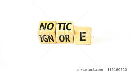 Notice or ignore symbol. Concept word Notice or Ignore on wooden cubes. Beautiful white table white background. Business lifestyle and notice or ignore concept. Copy space. 113160320