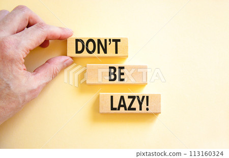 Motivational and do not be lazy symbol. Concept words Do not be lazy on wooden blocks on a beautiful white table white background. Businessman hand. Business do not be lazy concept. Copy space. 113160324