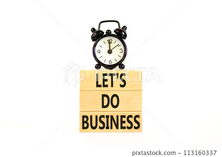 let is do business symbol. Concept words let is do business on beautiful wooden blocks. Beautiful white table white background. Black alarm clock. let is do business concept. Copy space. 113160337