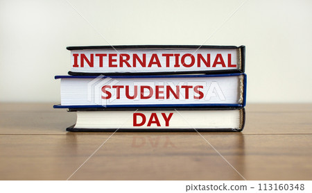 Books with text 'International Students Day' on beautiful wooden table, white background. Business and educational concept. Copy space. Books with text 'International Students Day' on beautiful wooden table, white background. Business and educational concept. Copy space. 113160348