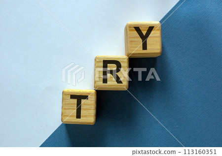 Wood blocks with word 'try' stacking as step stair on paper blue and white background, copy space. Business concept success process. 113160351