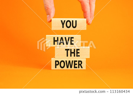 You have the power symbol. Concept word You have the power on beautiful wooden block. Beautiful orange background. Businessman hand. Business motivational you have the power concept. Copy space. 113160434